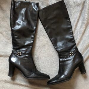 High heeled knee high black boots